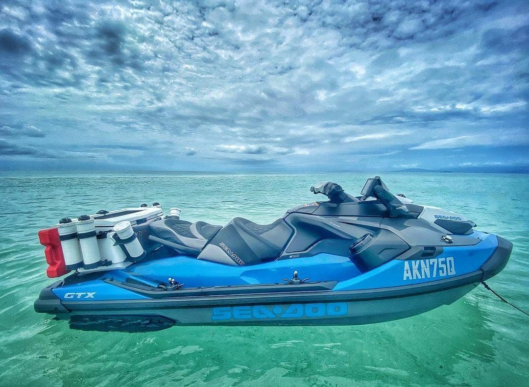 A jet ski is floating on top of a body of water.
