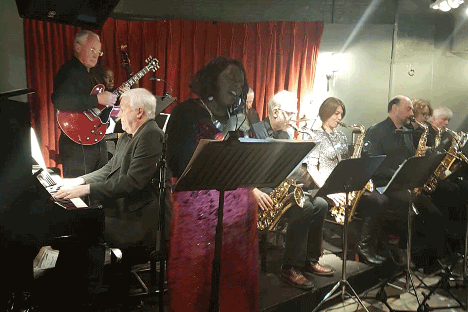 Winnie singing with band