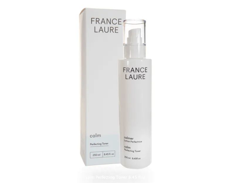 A bottle of france laure next to a box