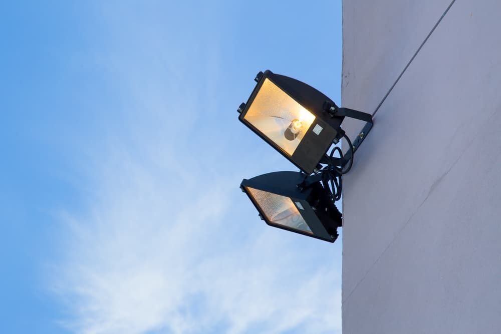 A Couple of Lights Hanging From the Side of a Building — Watkins Electrical In Pialba, QLD