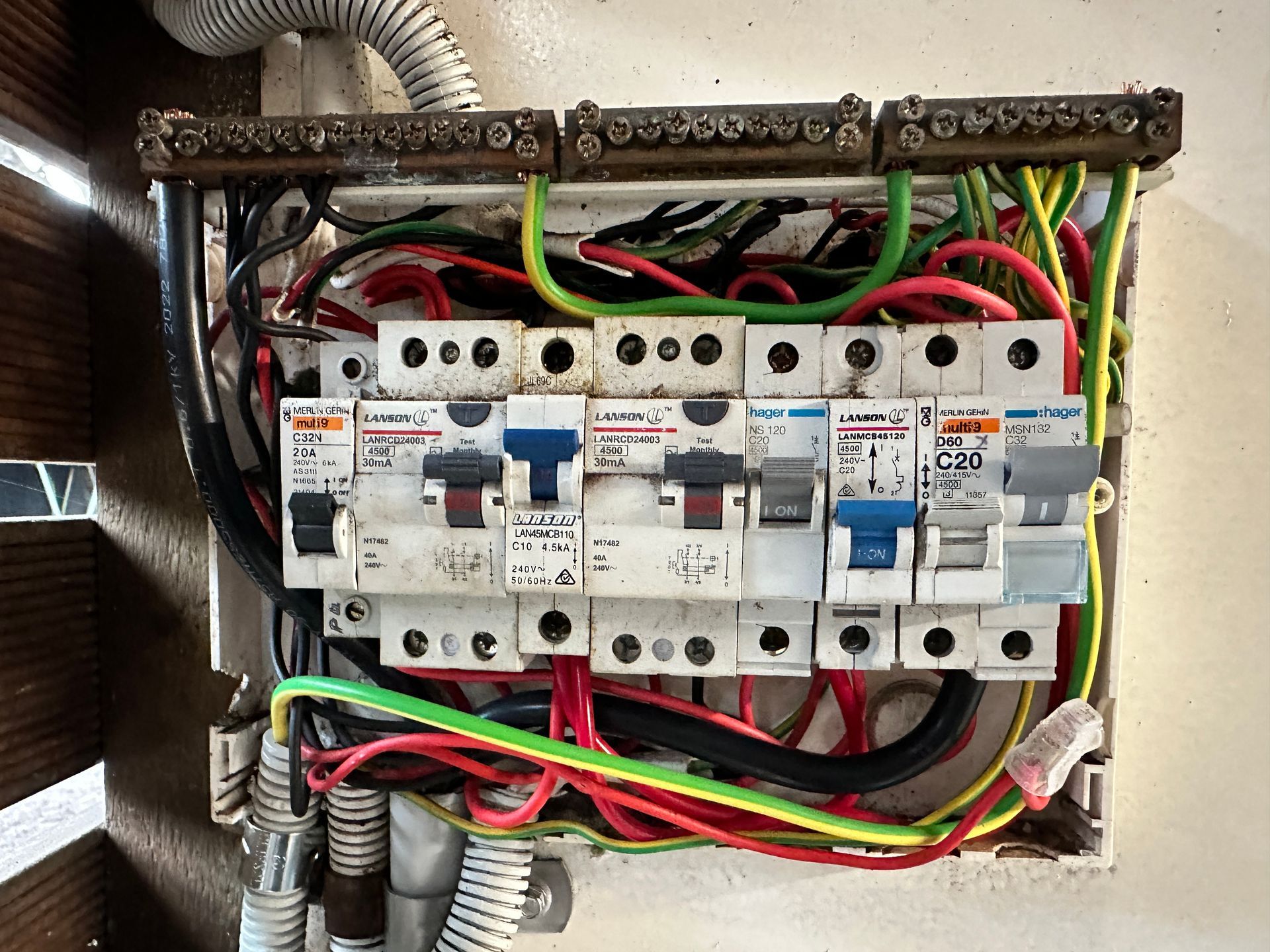 Electrician Working on a Circuit Breaker Panel — Watkins Electrical In Maryborough, QLD