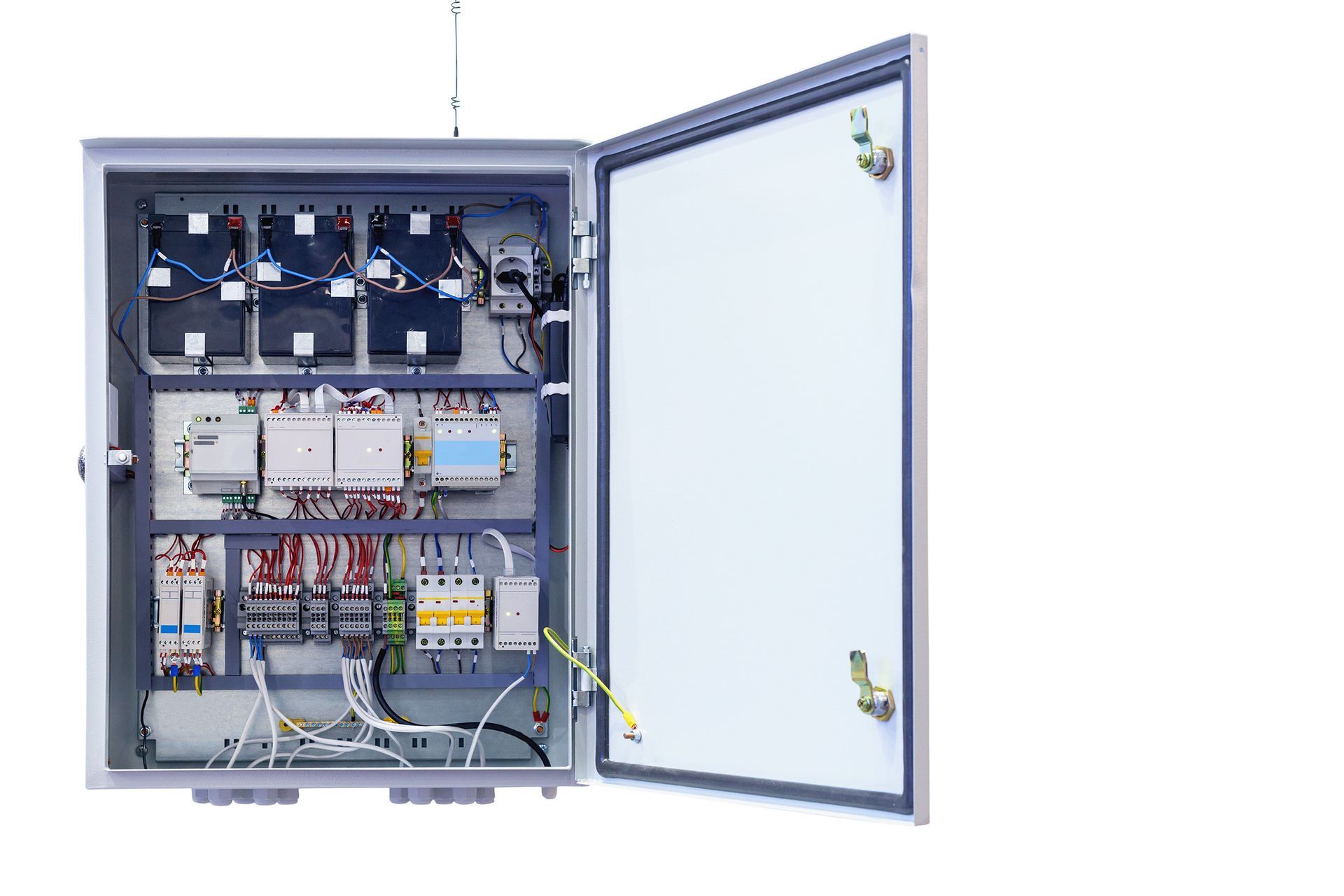 Open electrical control panel cabinet with wiring, circuit components, and open door