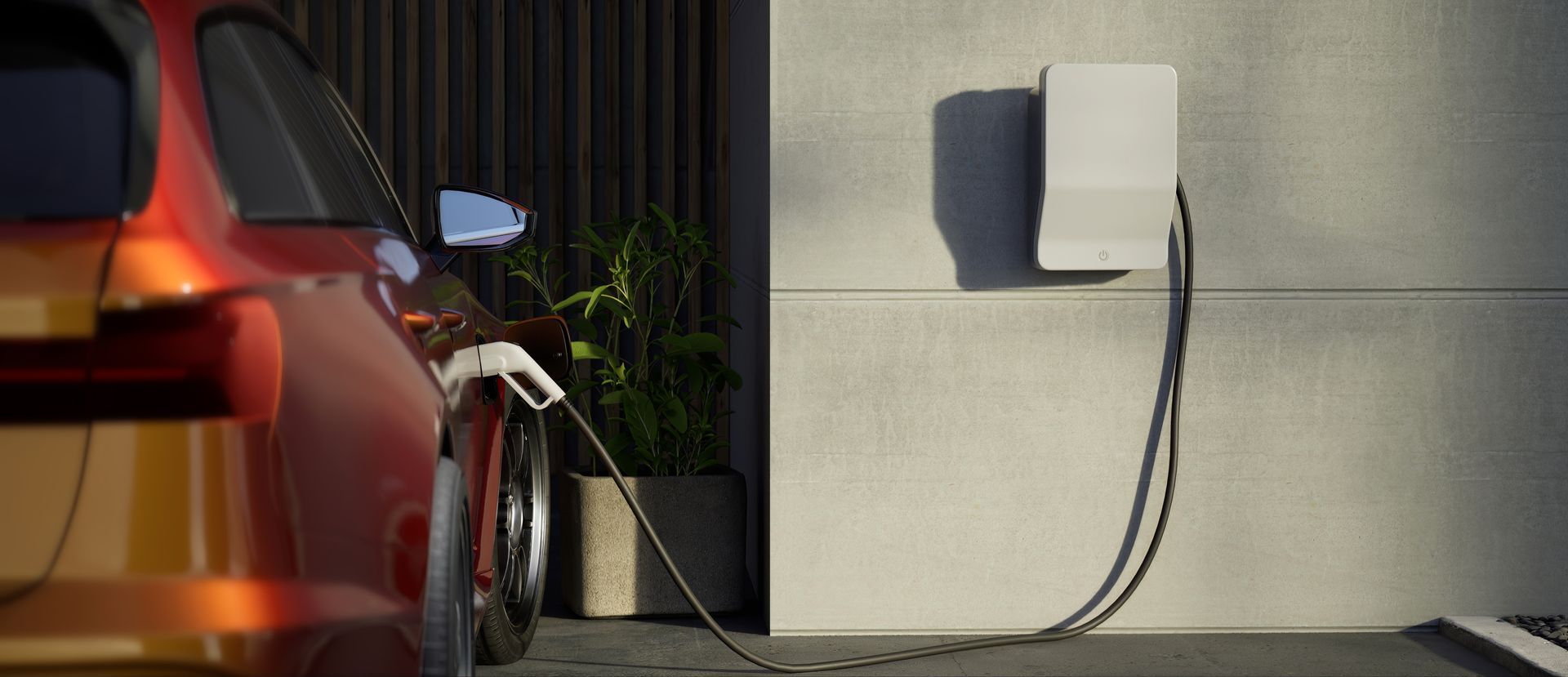 Black electric car charging beside a house, with greenery and a garage in the background