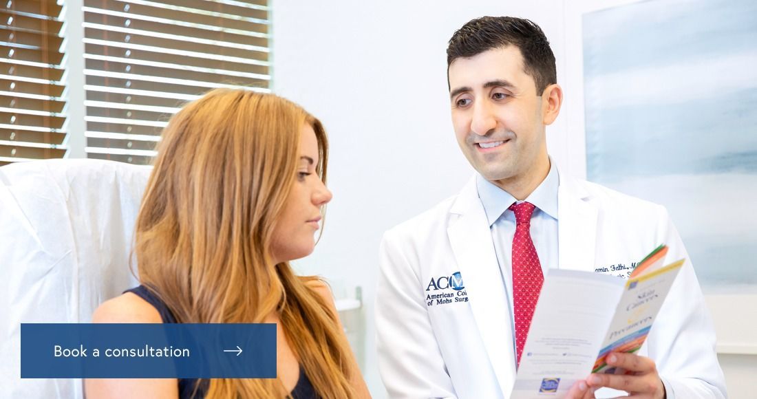 Dr. Ramin Fathi with a patient at phoenix surgical dermatology group