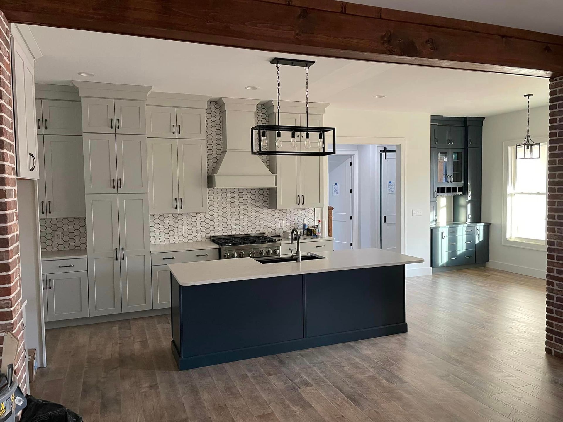 There is a large island in the middle of the kitchen.