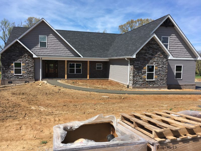 A house that is being built with a pallet in front of it