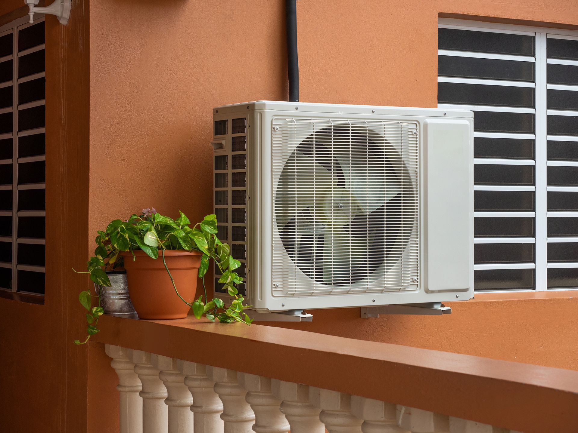 High-efficiency outdoor air conditioning unit beside a Florida home.