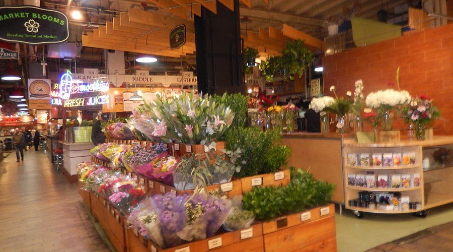 A market filled with lots of flowers and plants