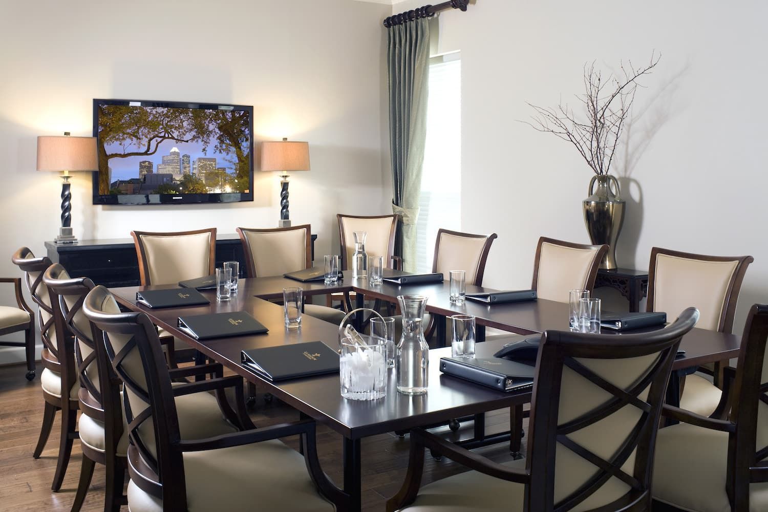 A conference room with a large table and chairs