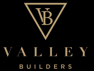 Valley Builders logo with gold VB triangle mark on black background