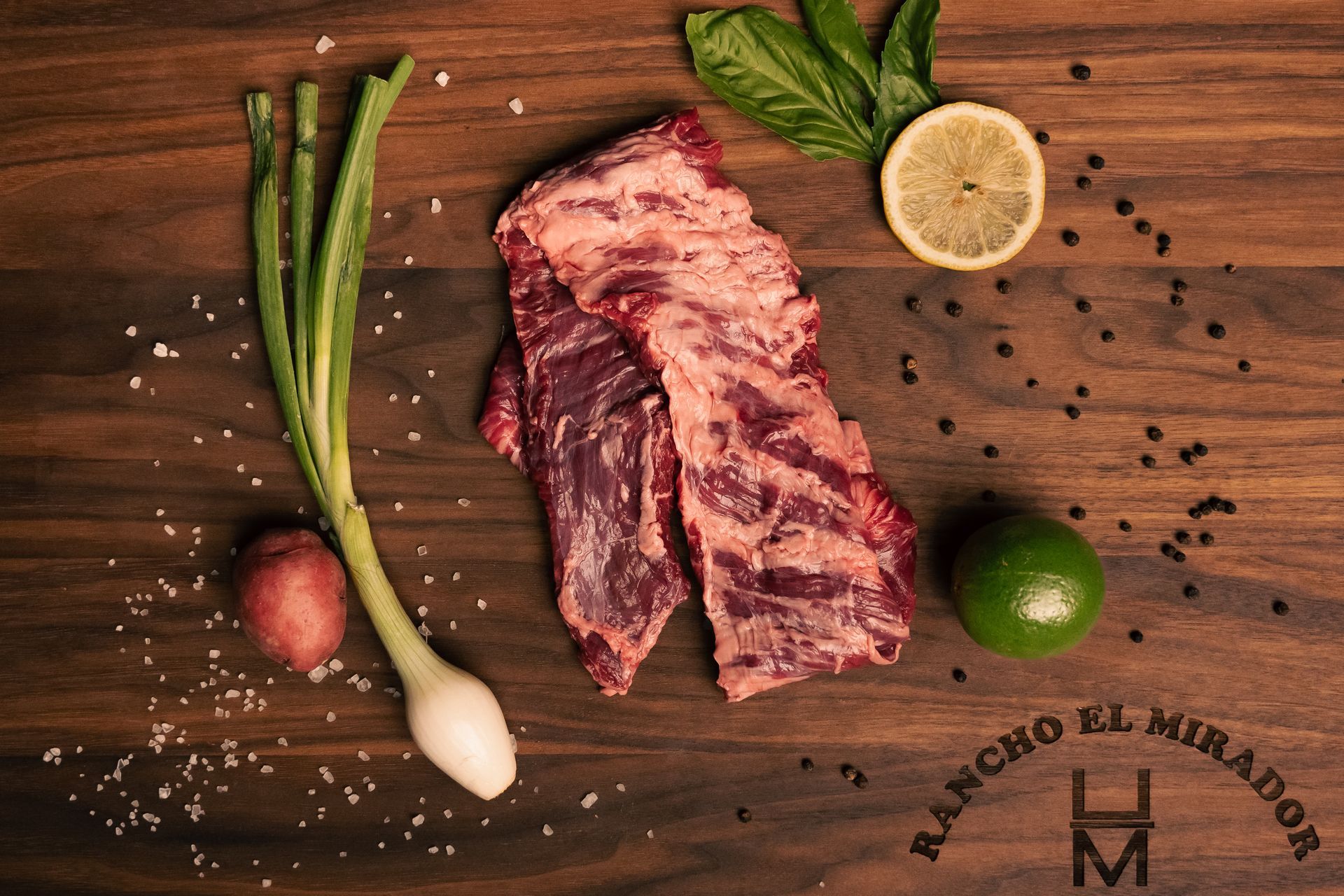 A rancho el mirador logo is on a wooden cutting board