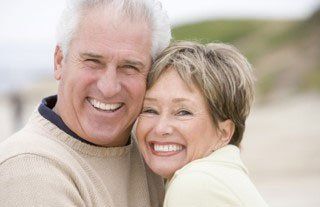 man and woman smiling