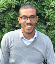A headshot of Philip Reeves smiling