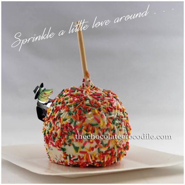 white chocolate covered apple with sprinkles