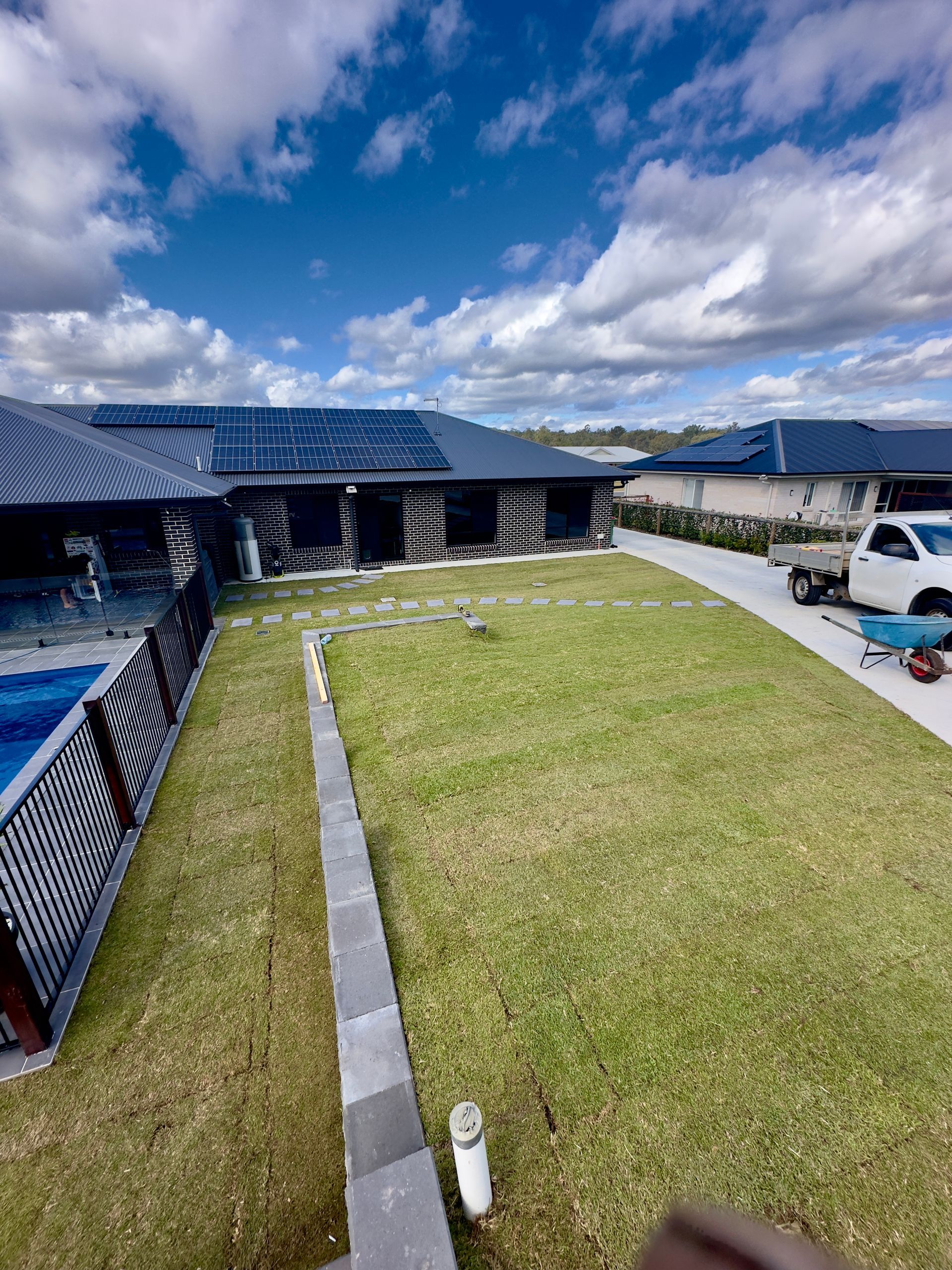 A Lawn Mower Is Cutting A Lush Green Lawn — Joe's Turf In Warwick, QLD