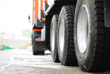 Up close to wheels of semi truck | CL Enterprises