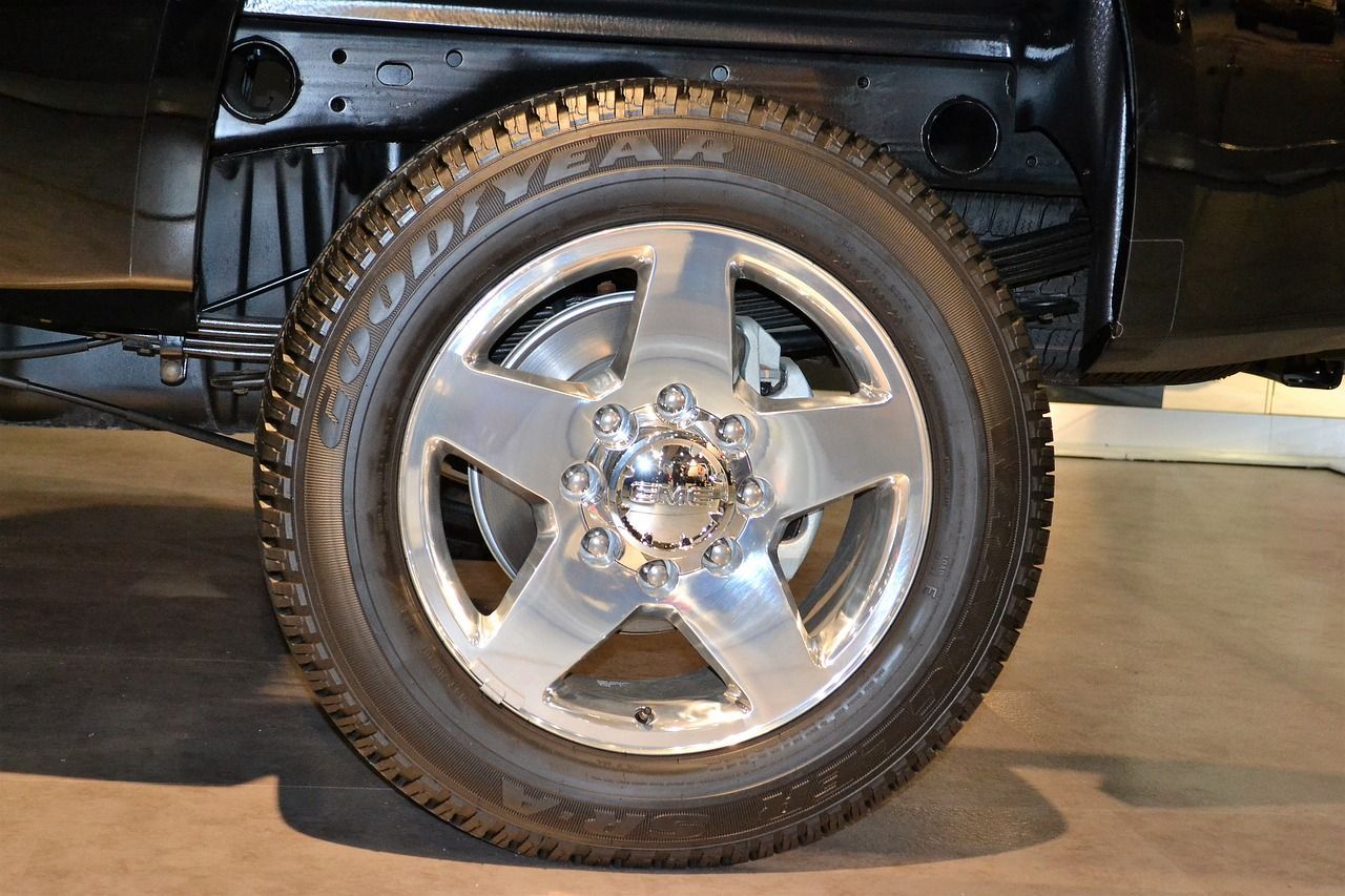 A close up of a car wheel with a tire on it.