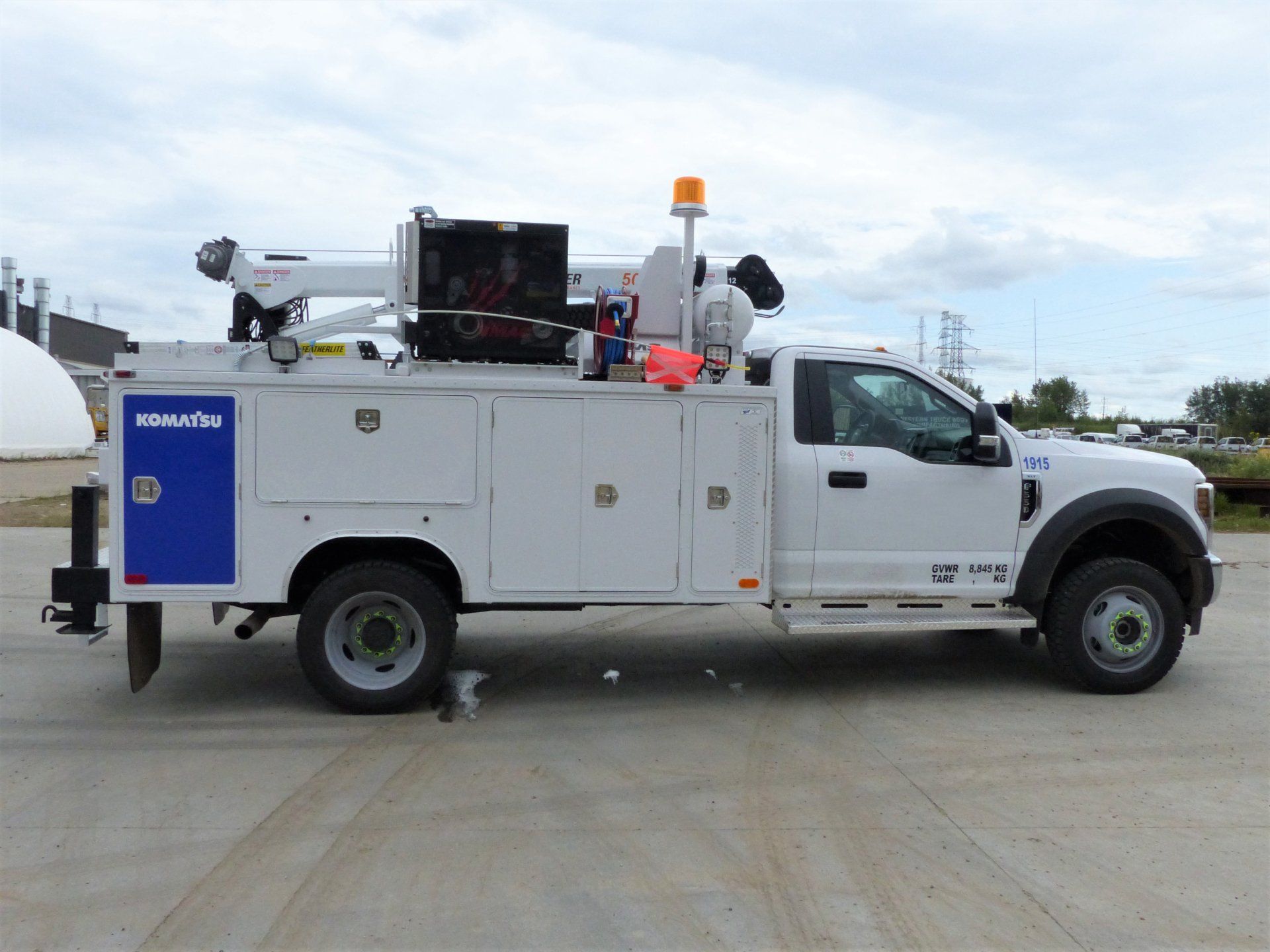 white mini service truck with installed service body