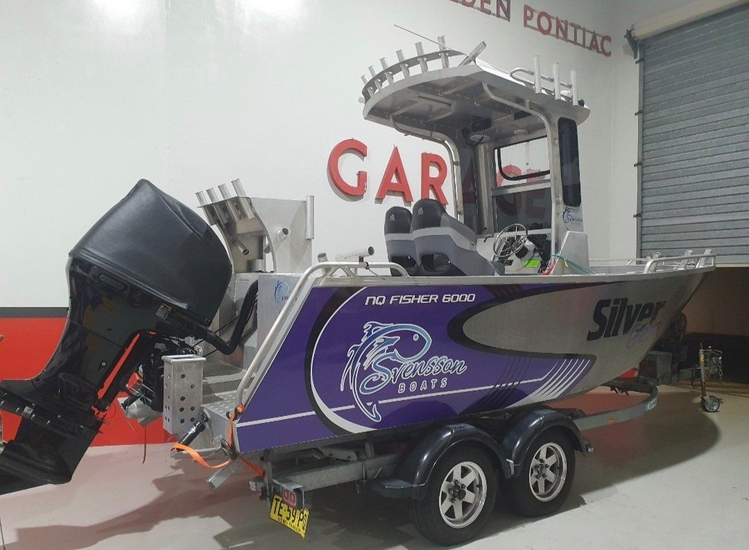 Aluminum Boat on Trailer With Black Motor — Motorhead Garage in Tweed Heads, QLD