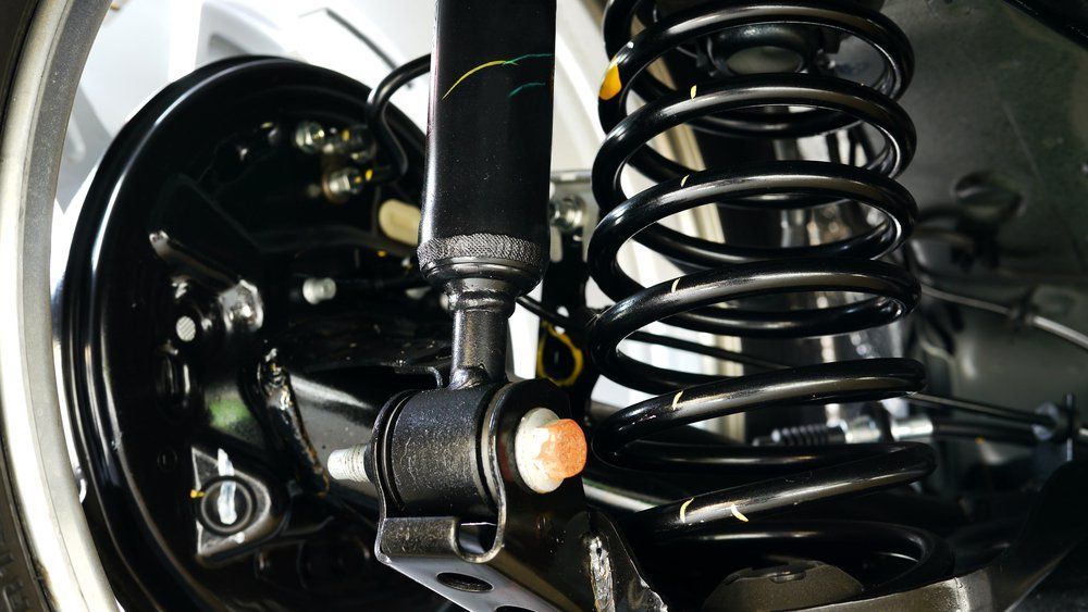 Car Suspension System With a Black Shock Absorber — Motorhead Garage in Tweed Heads, QLD