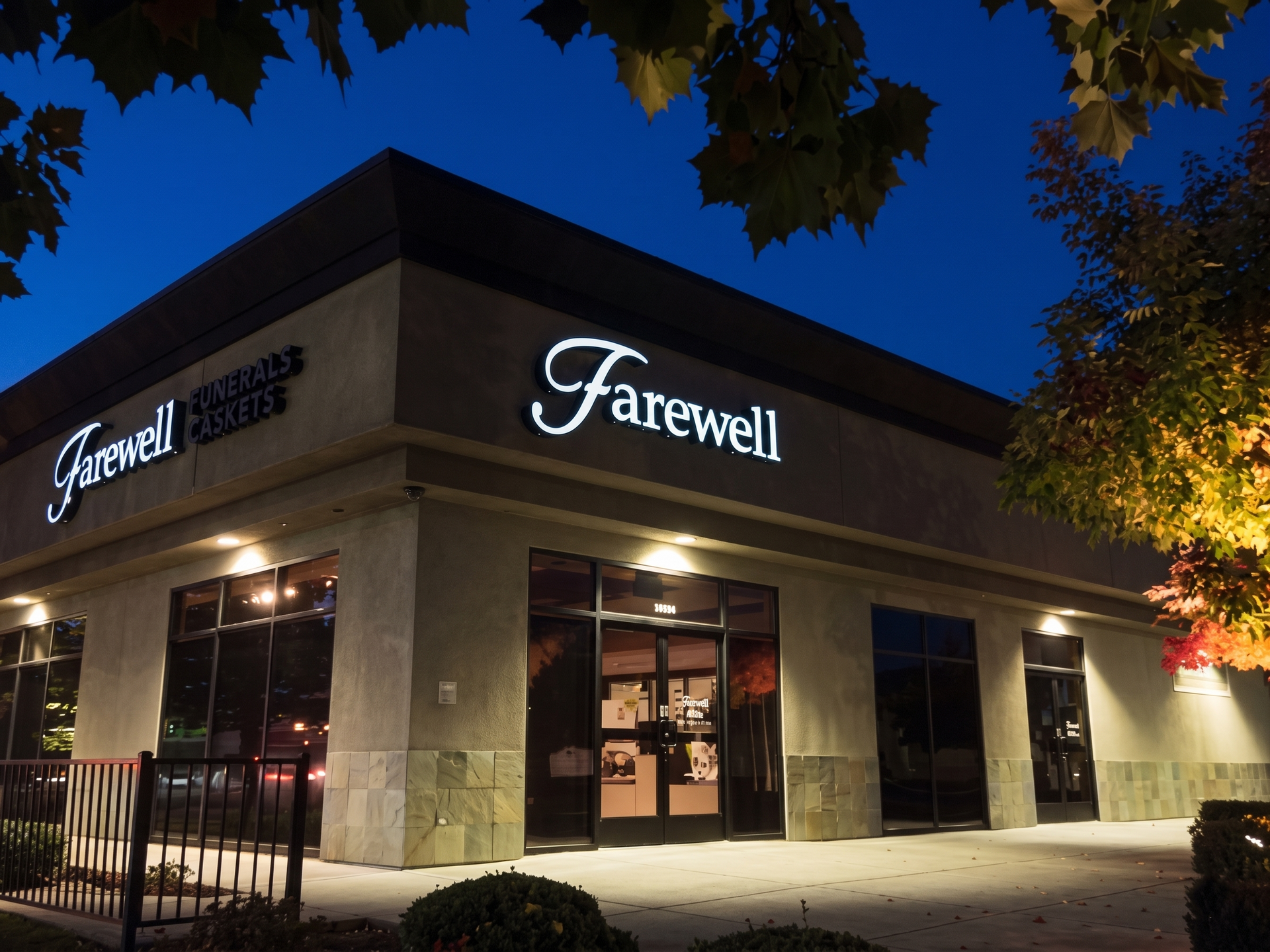 Farwell storefront at night with illuminated sign, glass entrance, and trees overhead