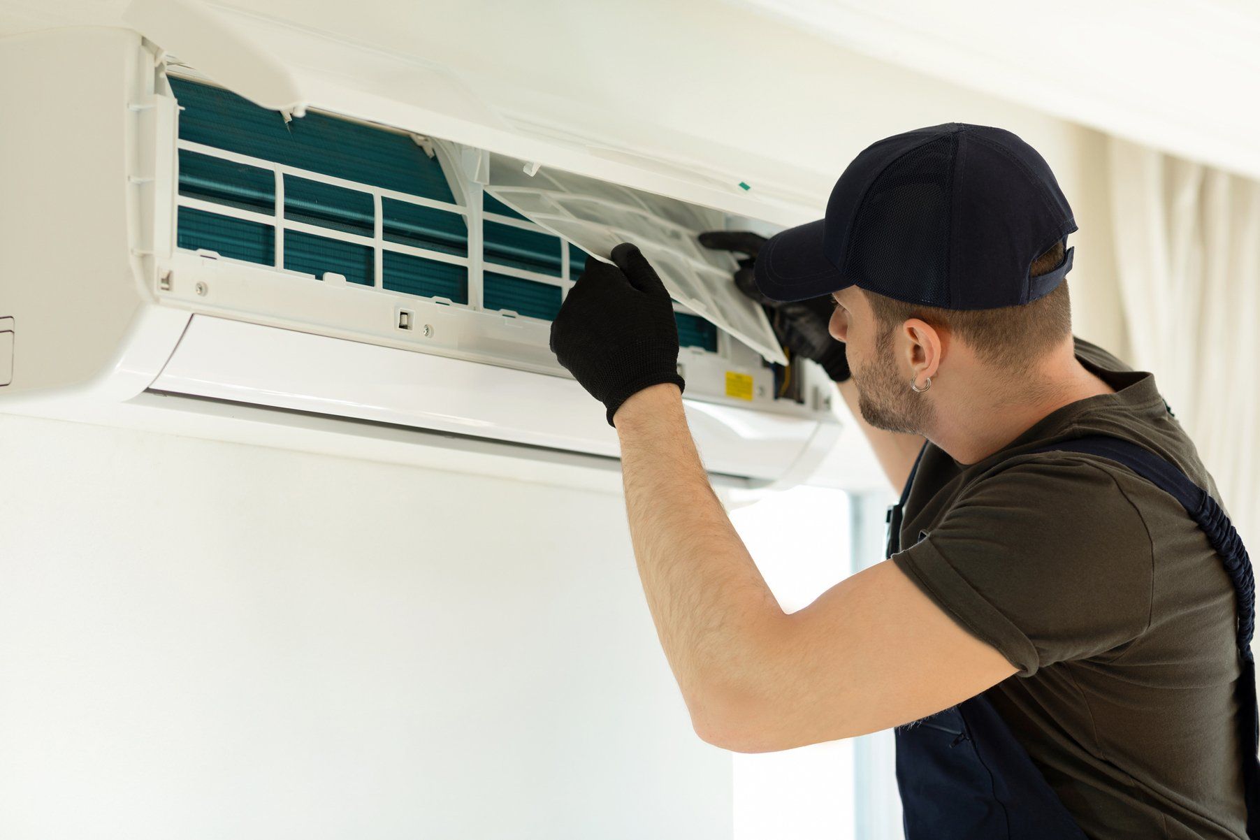 Man Cleaning Air Conditioner — Sydney, NSW — Bear Air