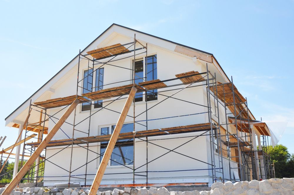 A house is being built with scaffolding around it.