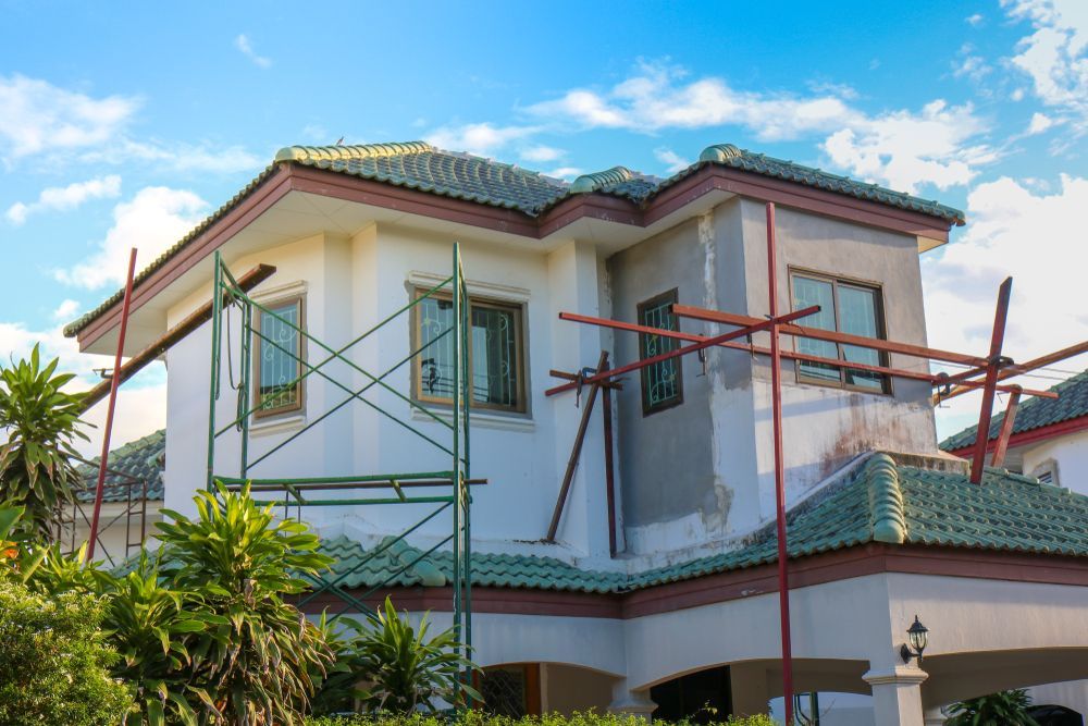 A house is being built with scaffolding around it.