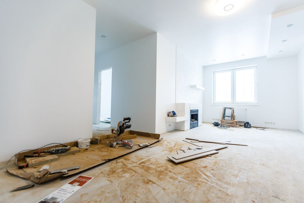 An empty room with a lot of tools on the floor.