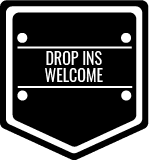A black and white sign that says `` drop ins welcome ''.
