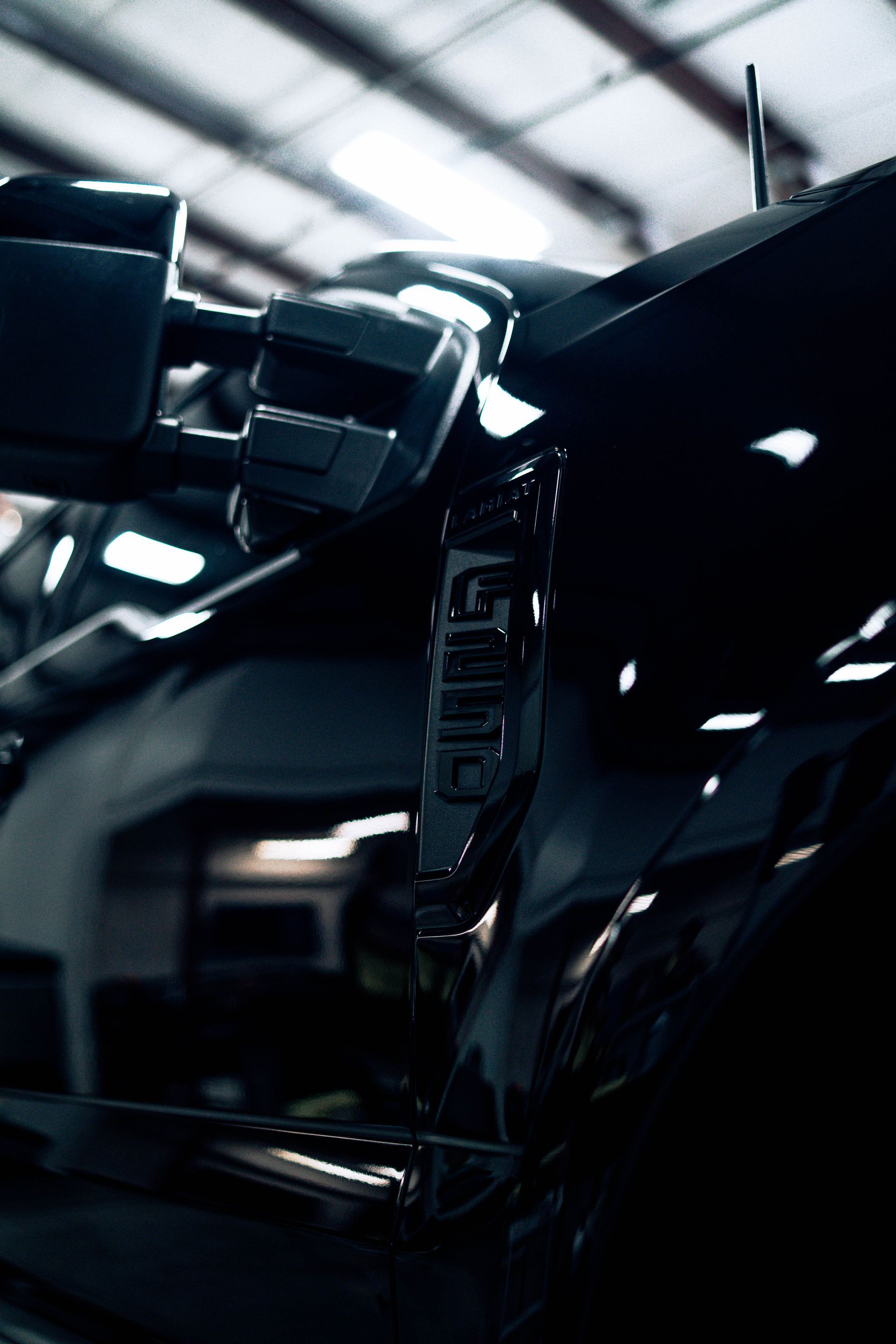 Deep gloss on a black panel ceramic coated at 719 Auto Customs