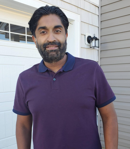 A picture of Nid a handsom man with dark hair and eyes