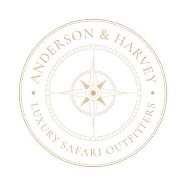 A circular logo in light tan featuring a compass rose in the center with the text