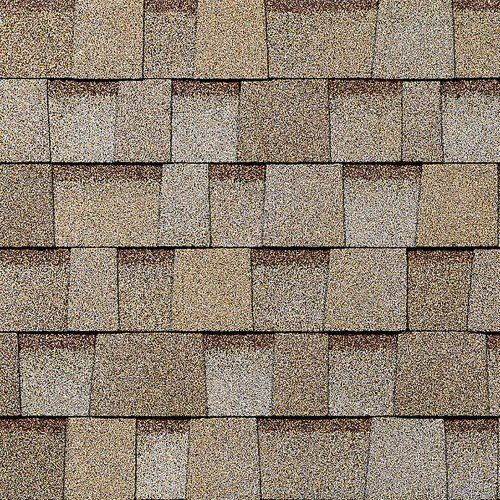 Close-up of tan and brown shingle roofing with a repeating textured pattern