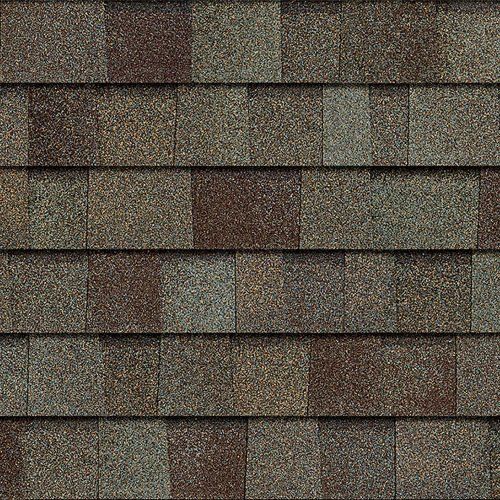 Close-up of weathered brown and gray roof shingles in a repeating pattern