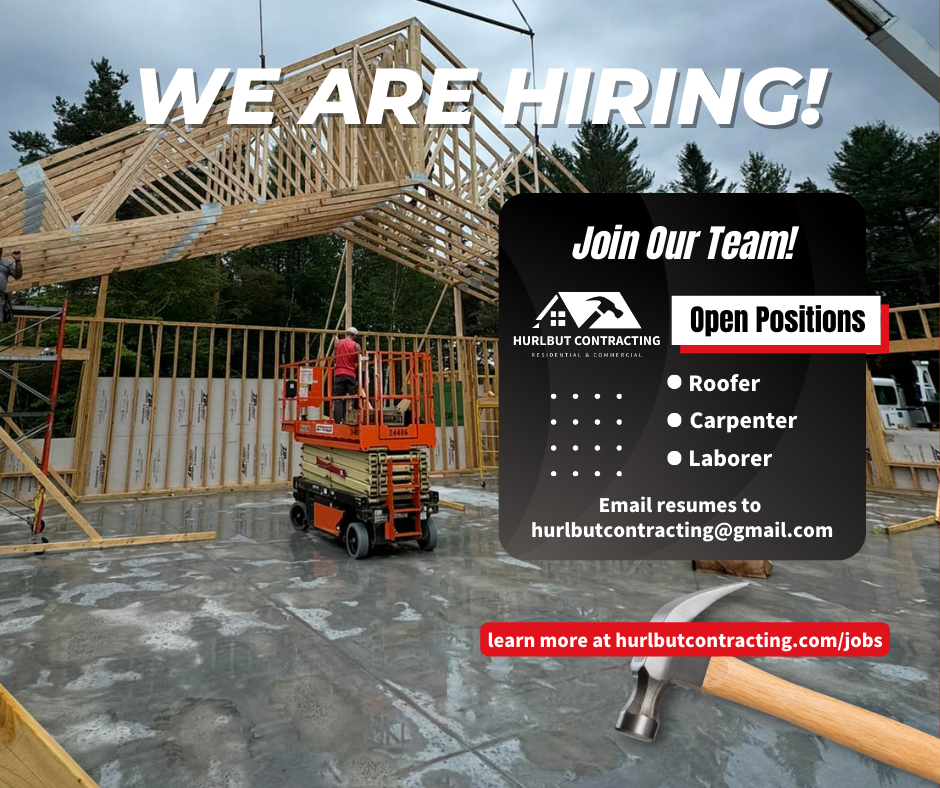 We’re hiring sign at a house construction site with open positions for roofer, carpenter, and laborer.