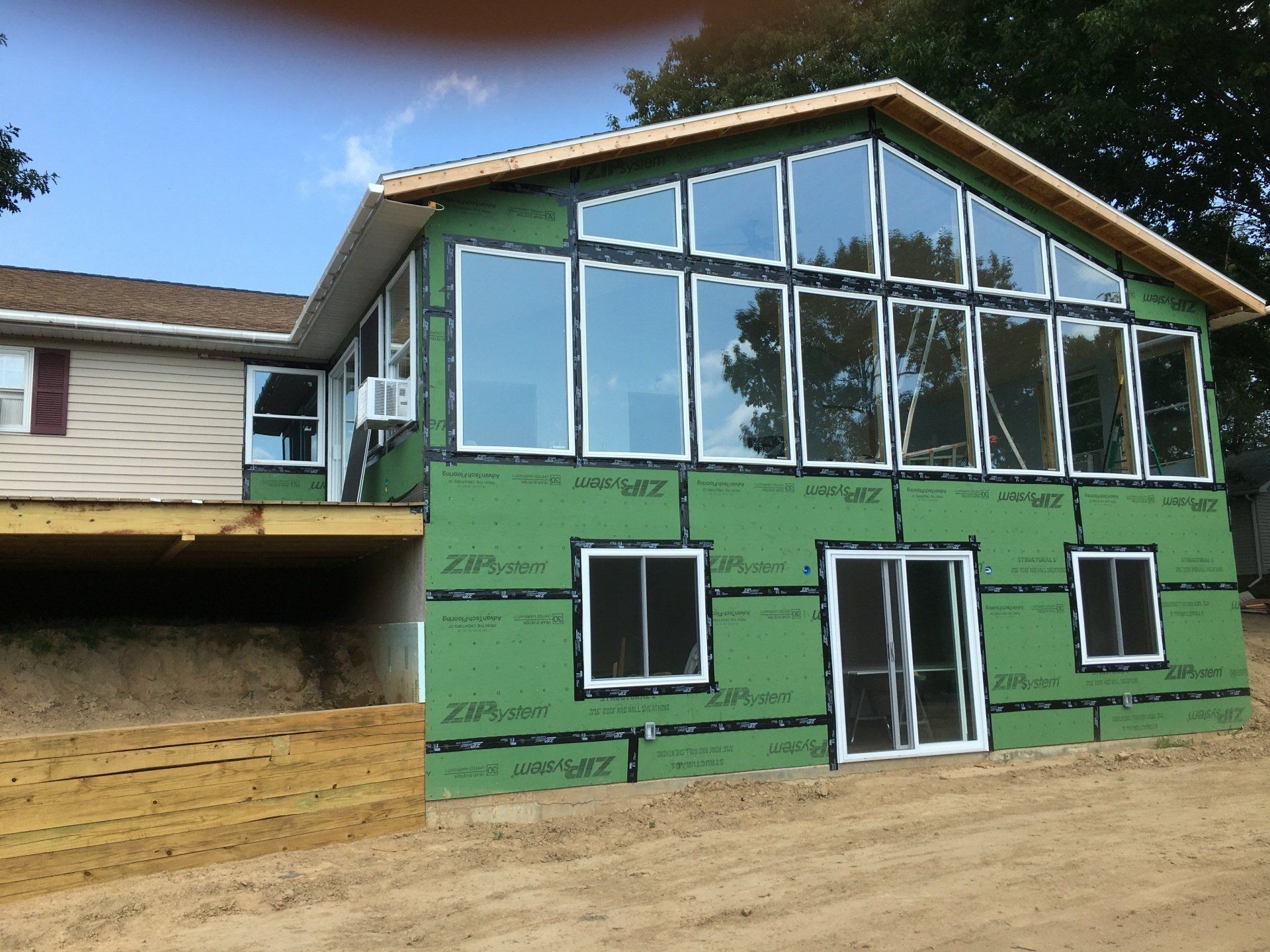 A house with a lot of windows is being built