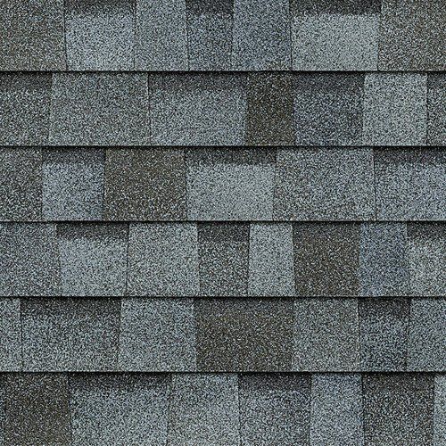Gray asphalt roof shingles in a staggered pattern