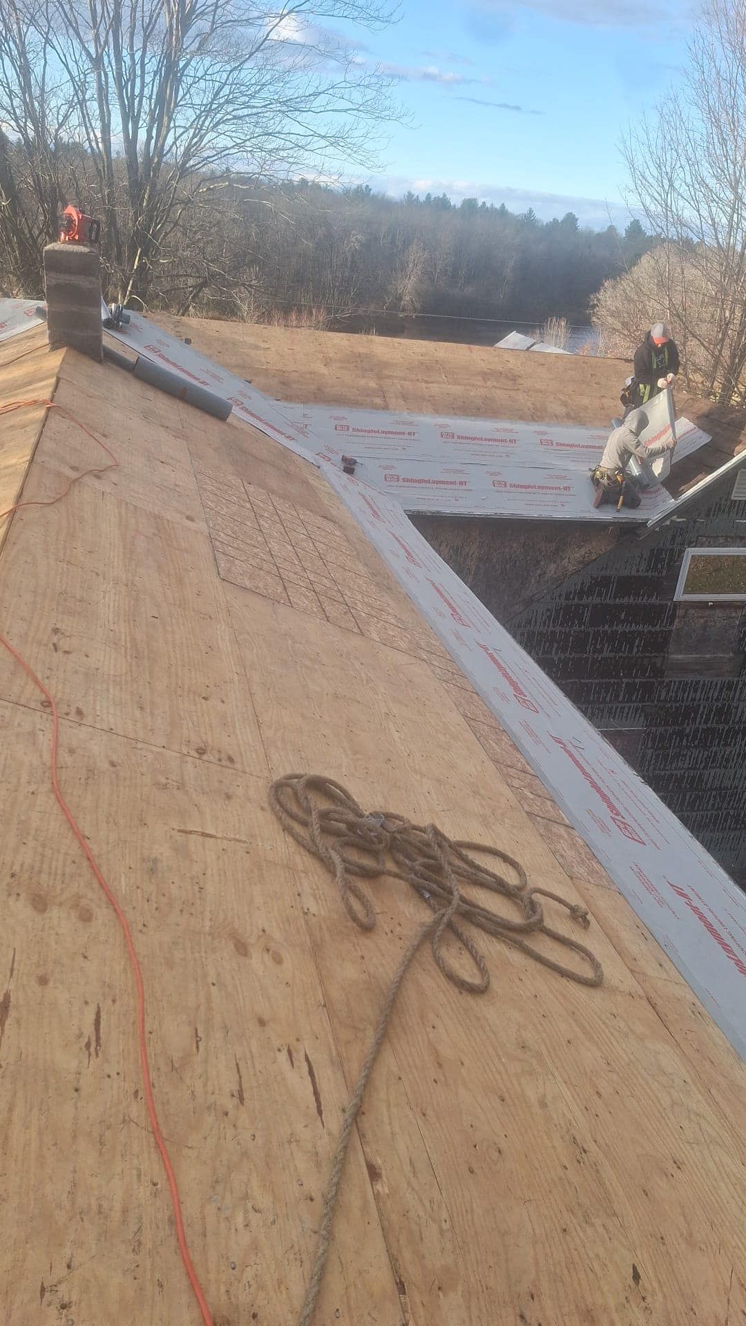 A rope is laying on the roof of a building.
