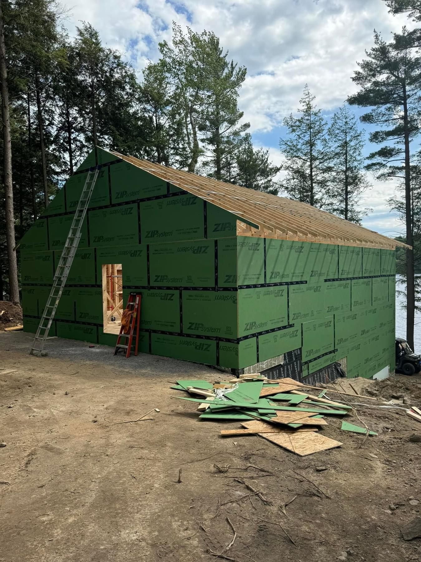 A building is being built in the middle of a forest.