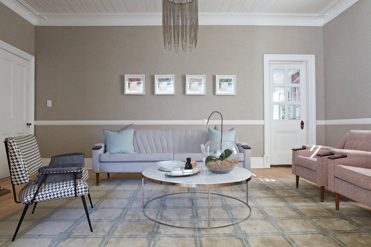 Elegant living room with soft beige walls, comfortable seating, and decorative touches in York.