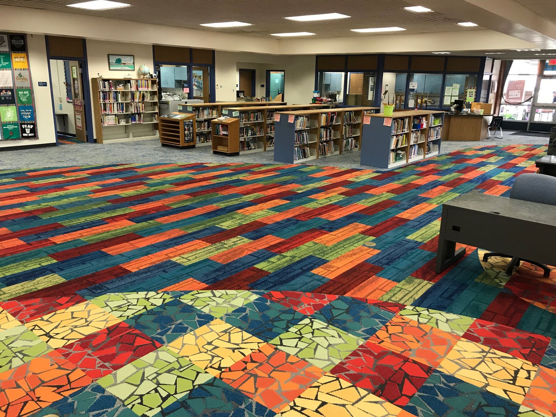 Colorful commercial carpet tile installed in a public library