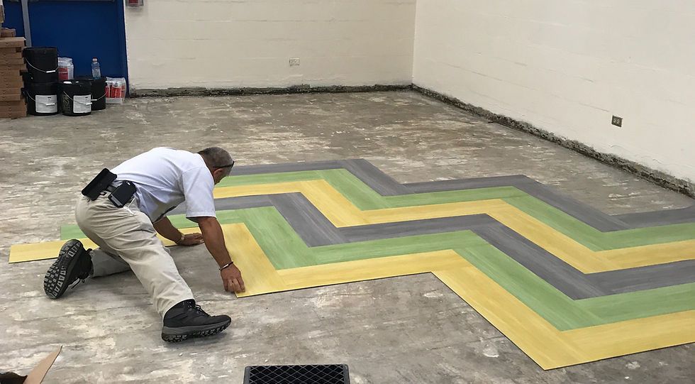 Commercial carpet tile installation in progress
