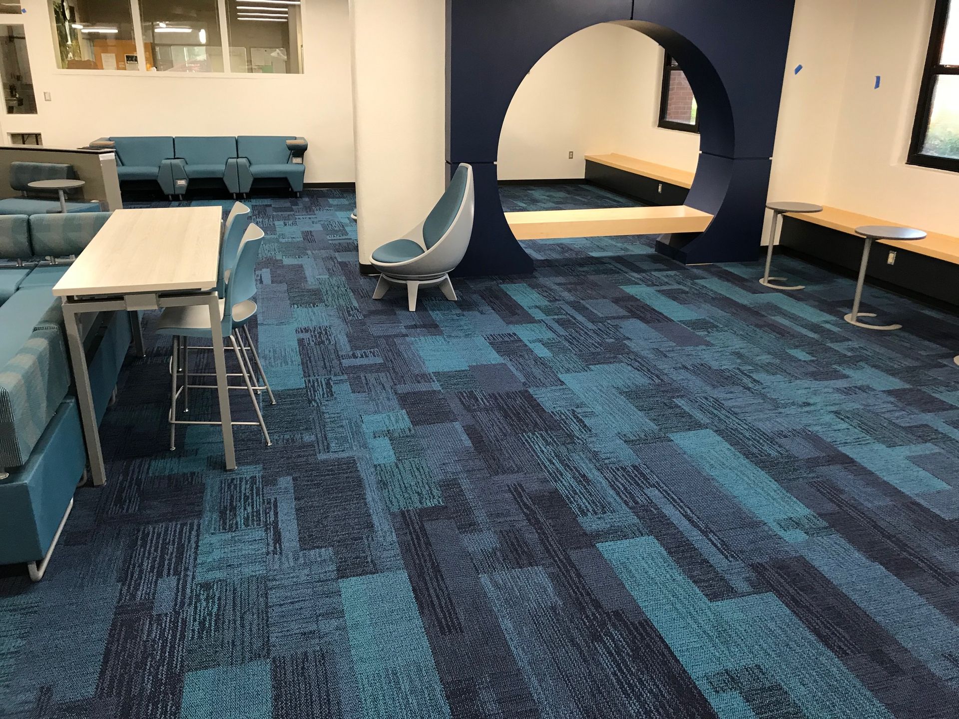 Modern library seating area with blue commercial carpet tile