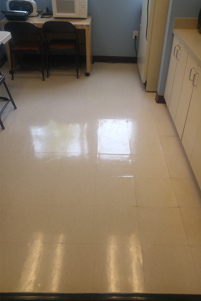 Commercial flooring before replacement in a staff room