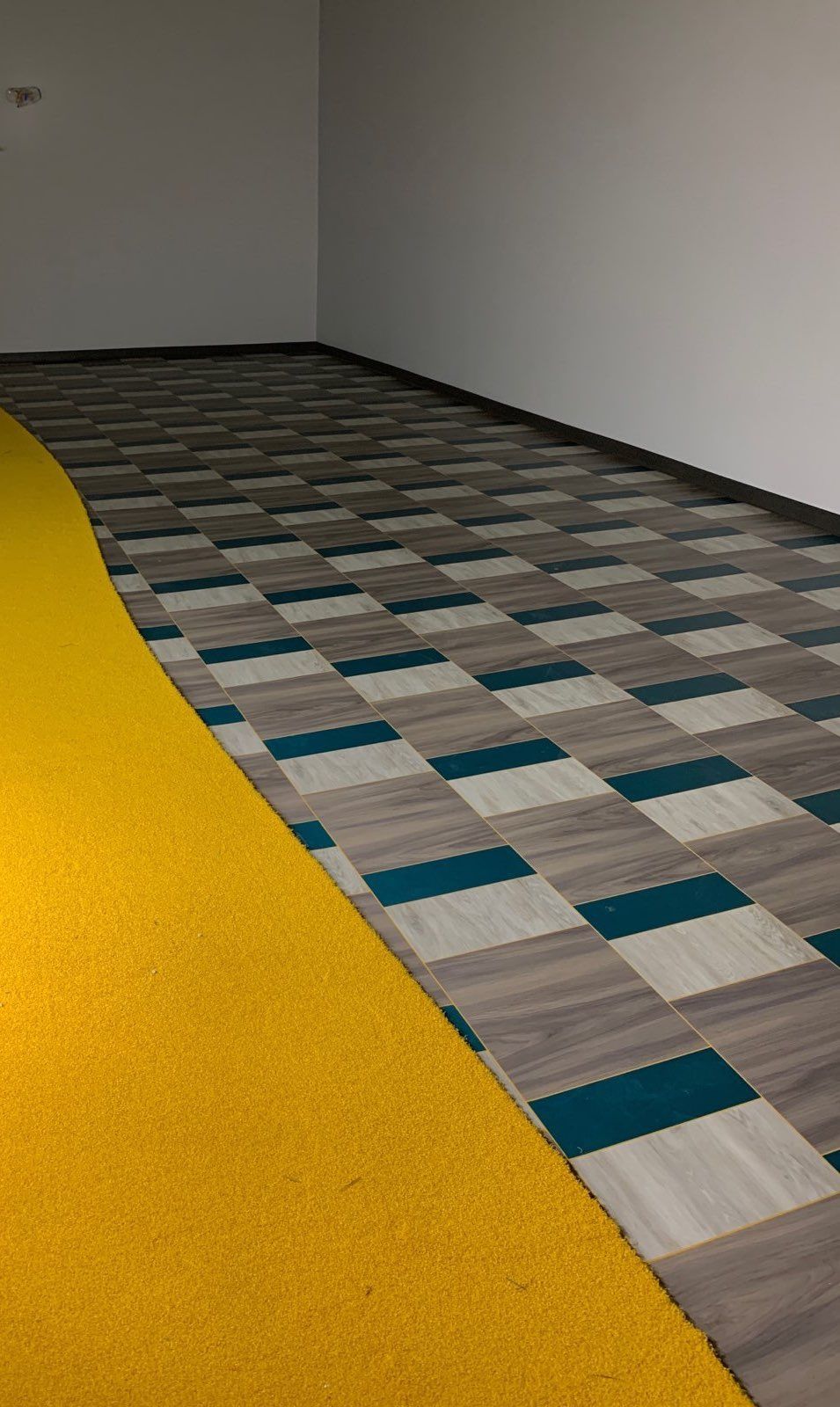 Commercial carpet tile installed in an empty room