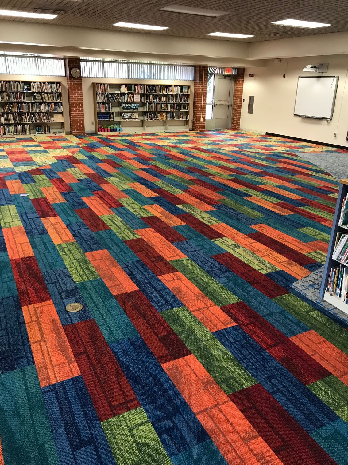 Library reading area with colorful carpet tile flooring