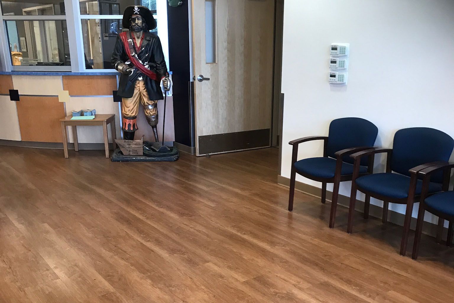 Wood-look commercial flooring in a public facility waiting area