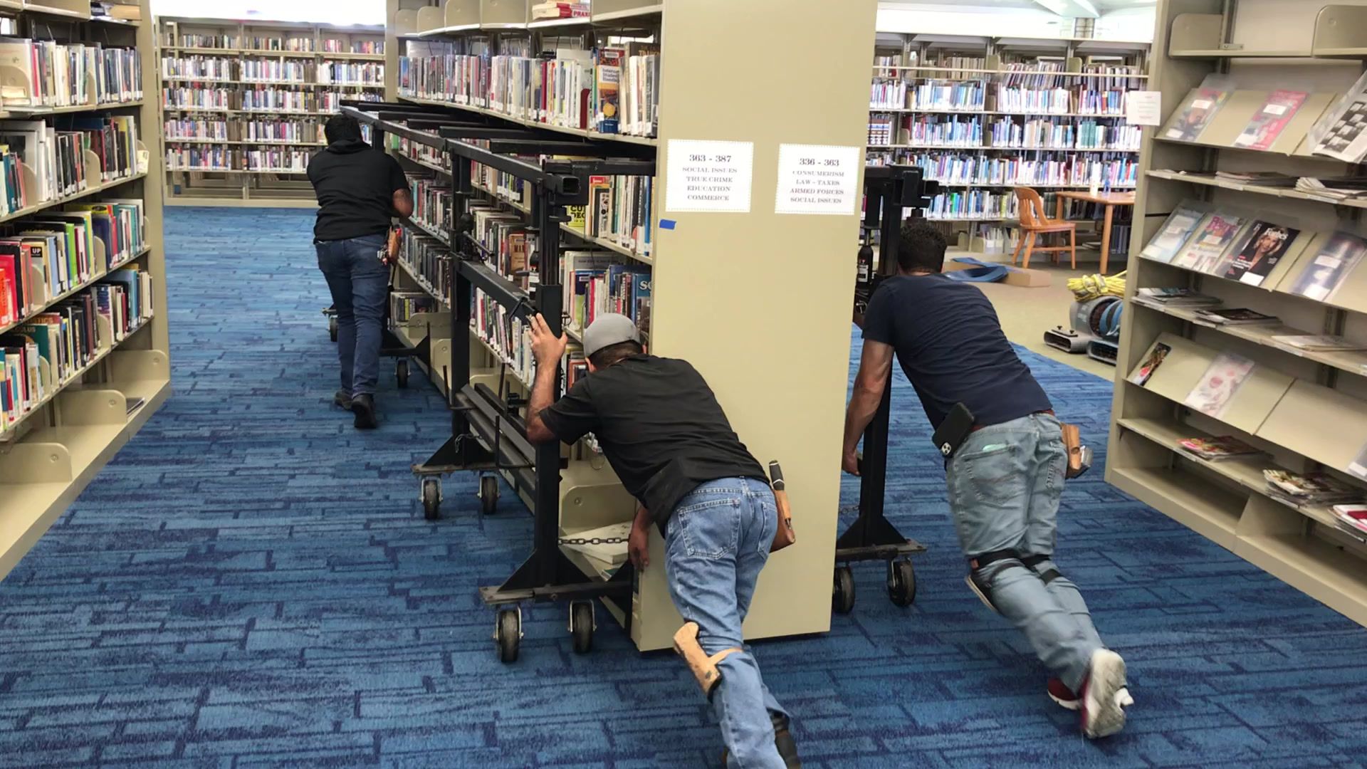 Library bookshelf moving during a flooring project