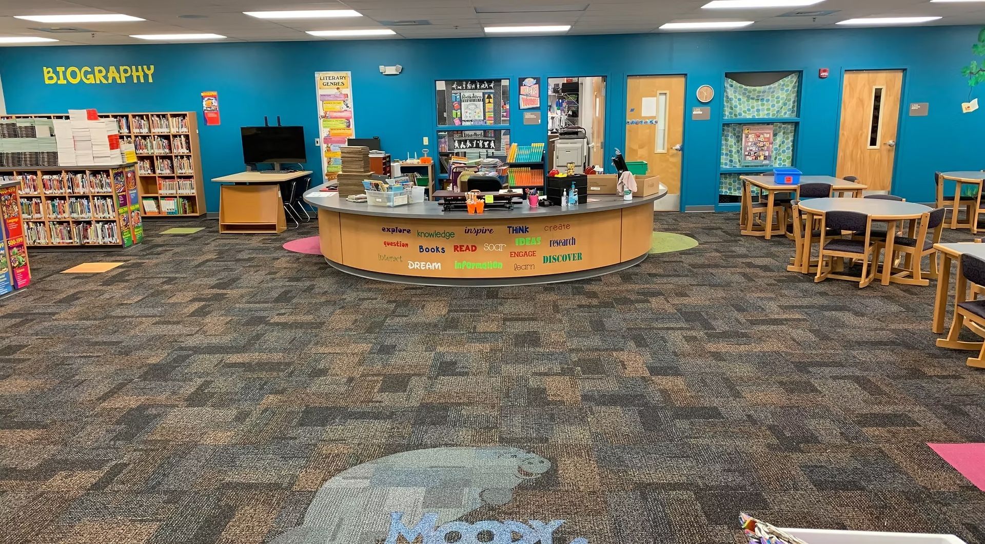 Children’s library area with patterned commercial carpet flooring